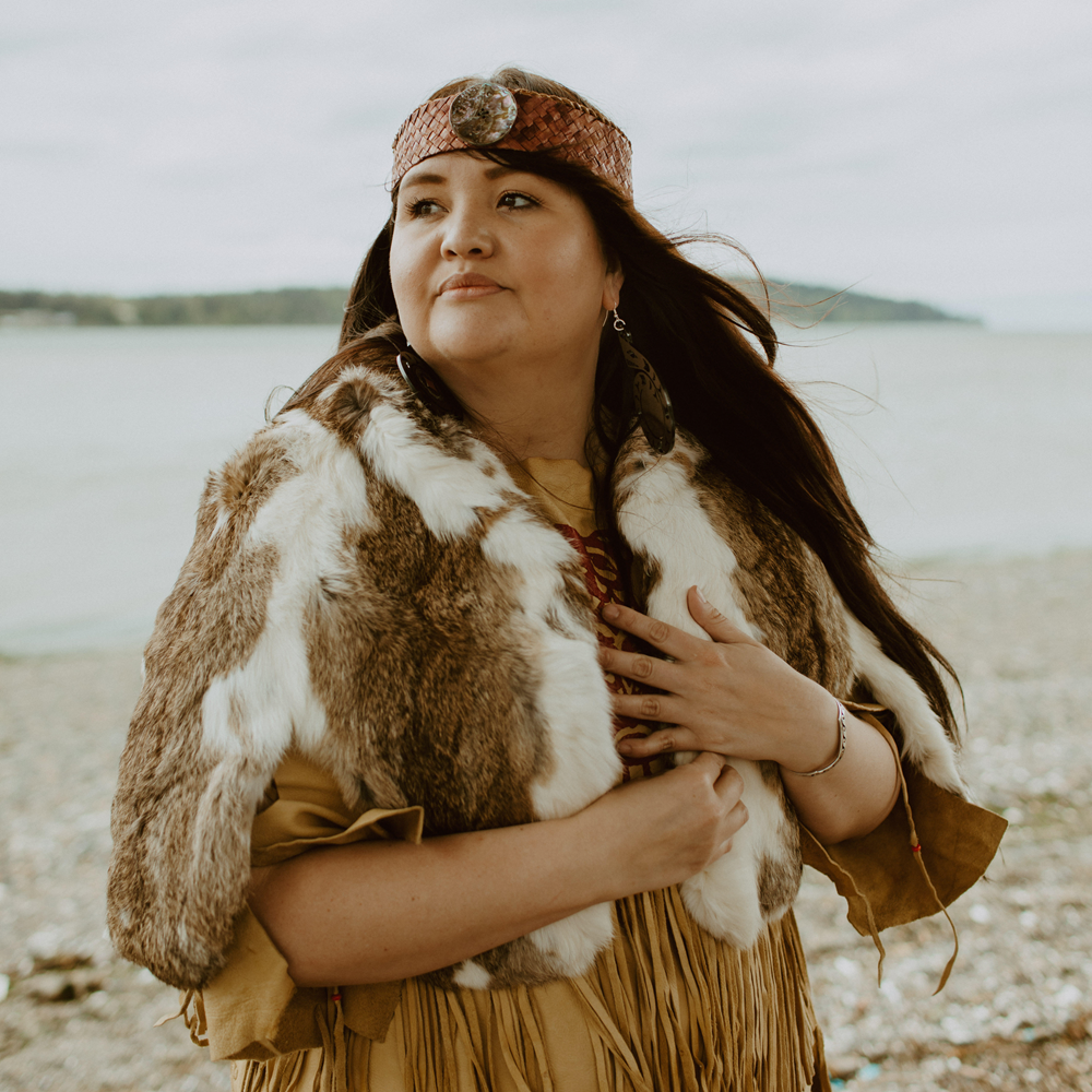 Vina, team member at Copper Canoe Woman, showcasing handmade jewellery