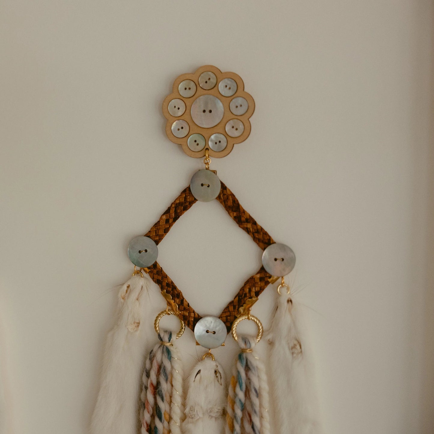 framed art rooted futures ermine earring cedar abalaone wool