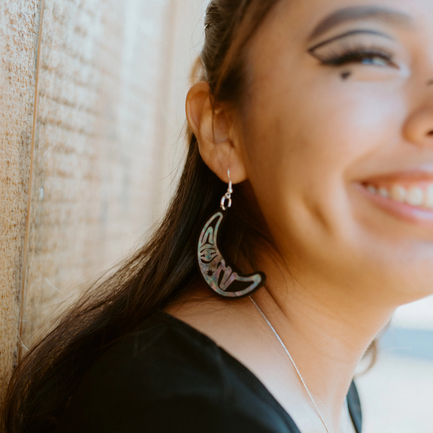 A closeup of the moon side of the "Hupal" earrings from Copper Canoe Woman.