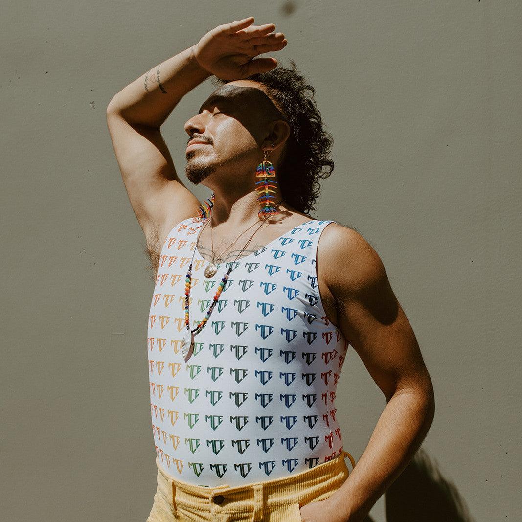 Model wearing medium salmon ghost pride earrings from Copper Canoe Woman.