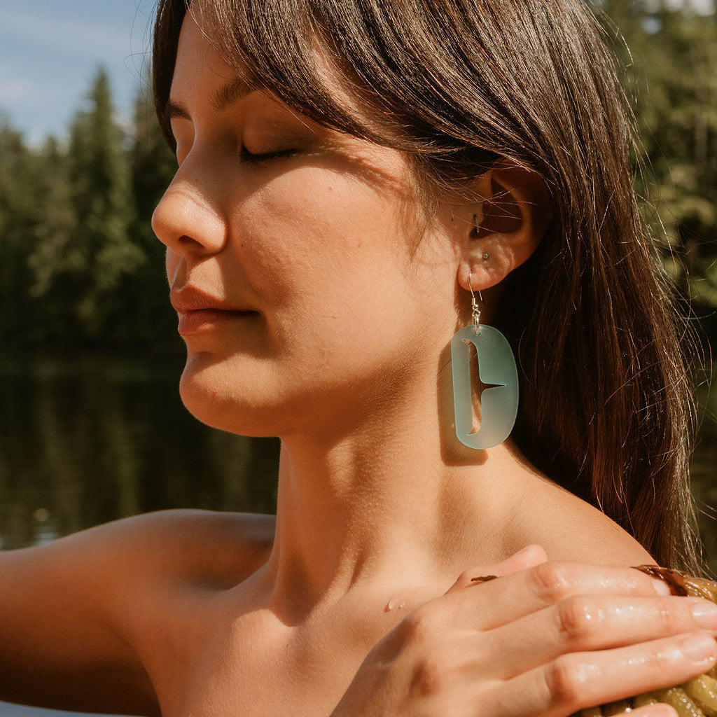 Women Wearing Small Ovoid Earring