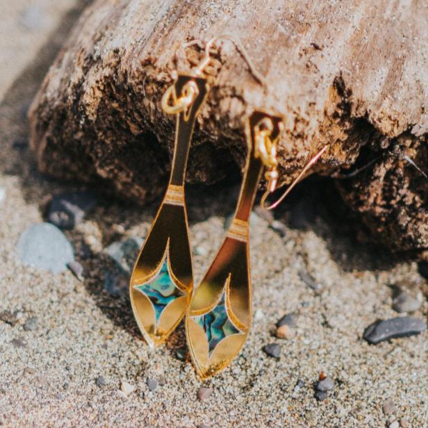 gold mirror acrylic paddle earring with star abalone inlay from copper canoe woman