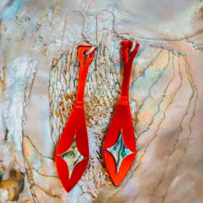red mirror acrylic paddle earring with star abalone inlay from copper canoe woman