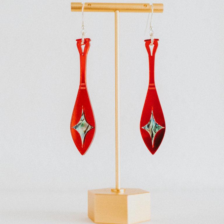 red mirror acrylic paddle earring with star abalone inlay from copper canoe woman