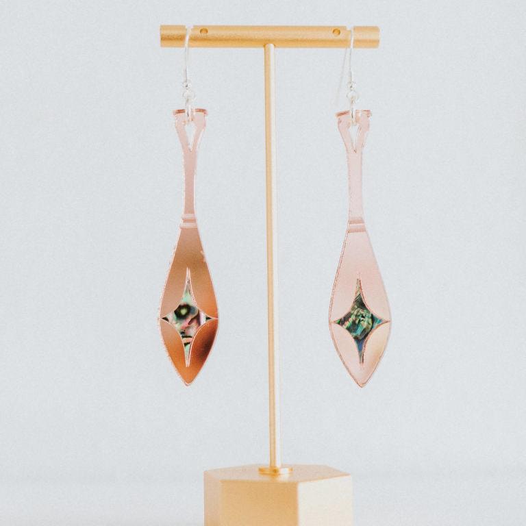 rose gold mirror acrylic paddle earring with star abalone inlay from copper canoe woman