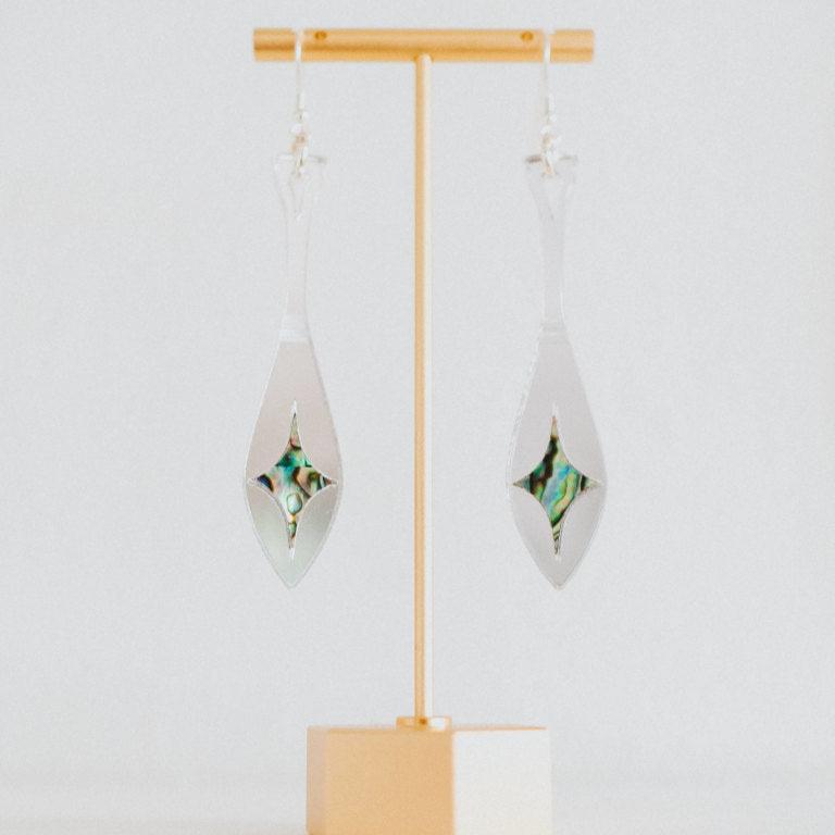 silver mirror acrylic paddle earring with star abalone inlay from copper canoe woman