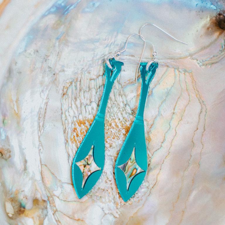 teal mirror acrylic paddle earring with star abalone inlay from copper canoe woman