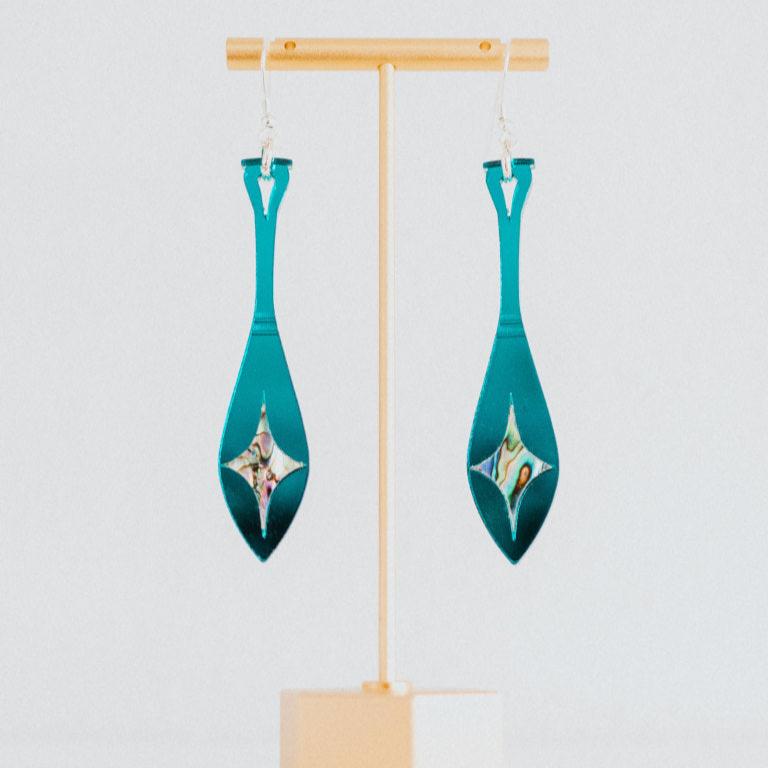 teal mirror acrylic paddle earring with star abalone inlay from copper canoe woman