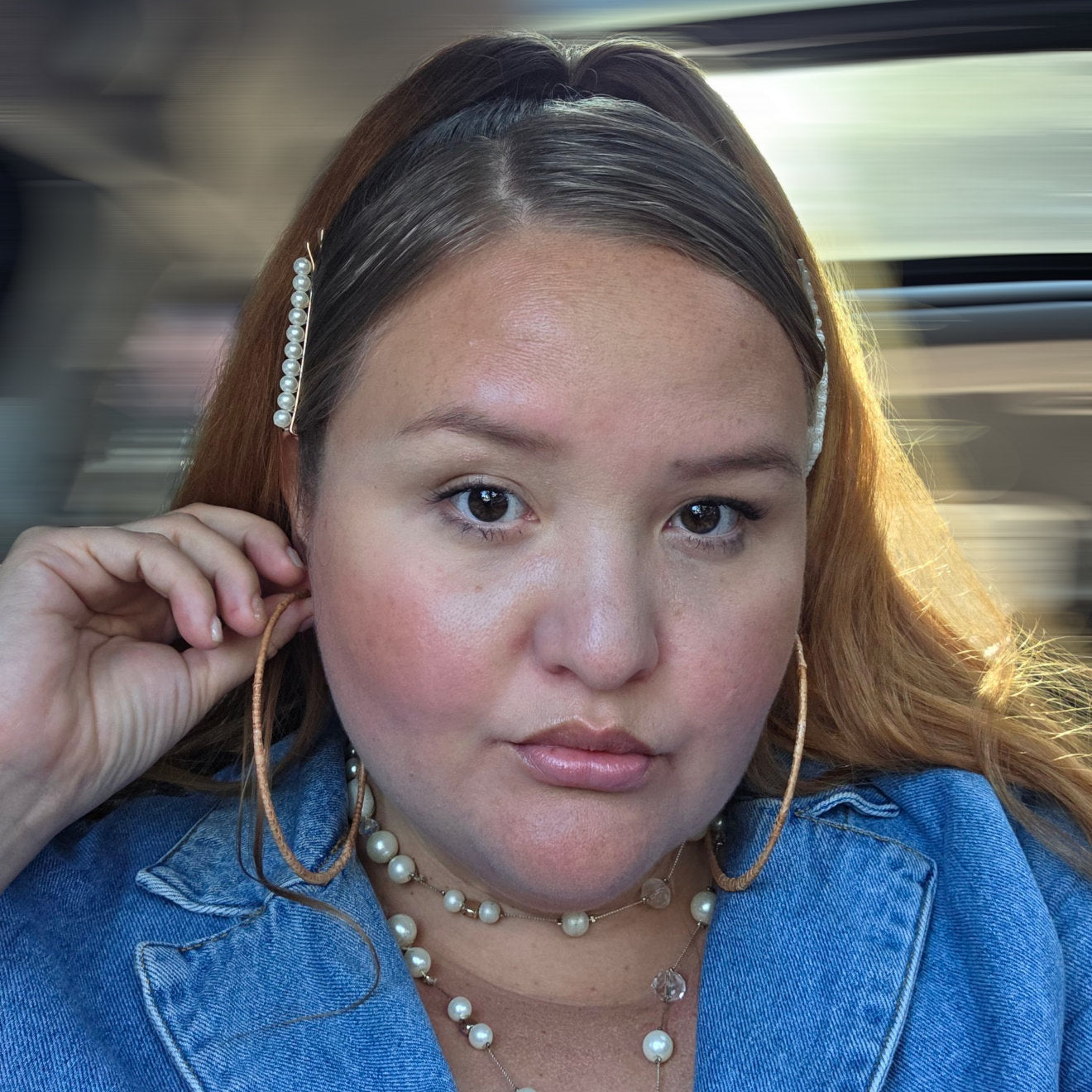Women wearing earthline cedar woven hoop earring thick band