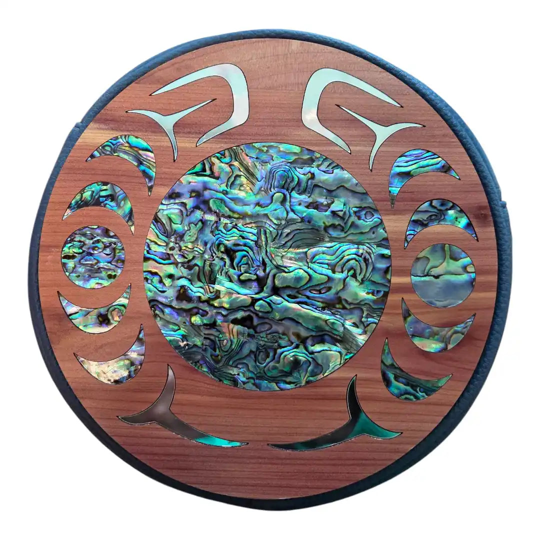 Decorative wall art with abalone shell inlay on a wooden circle