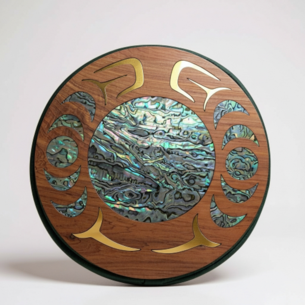 Round wooden plaque with abalone shell inlay on a white background