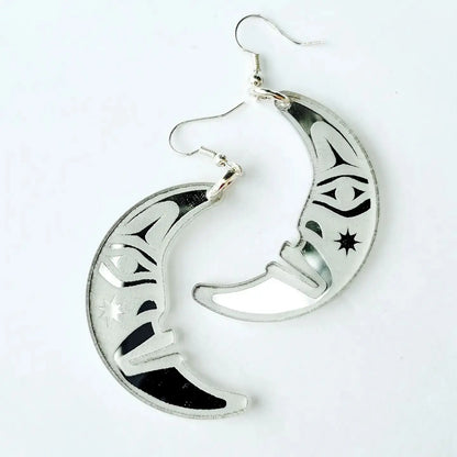 silver acrylic crescent moon engraved with formline art from copper canoe woman
