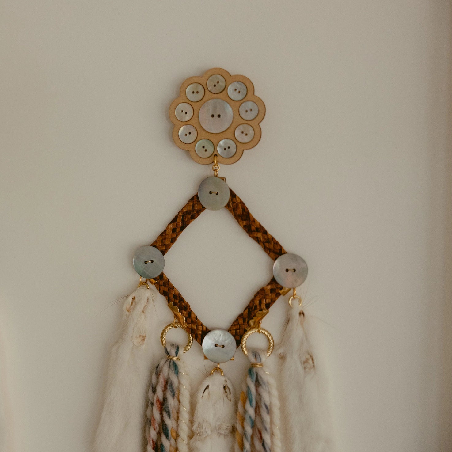 framed art rooted futures ermine earring cedar abalaone wool 