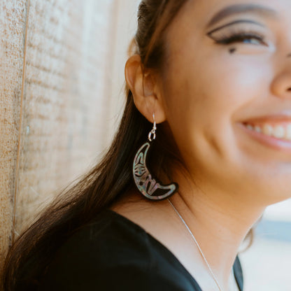A closeup of the moon side of the "Hupal" earrings from Copper Canoe Woman.