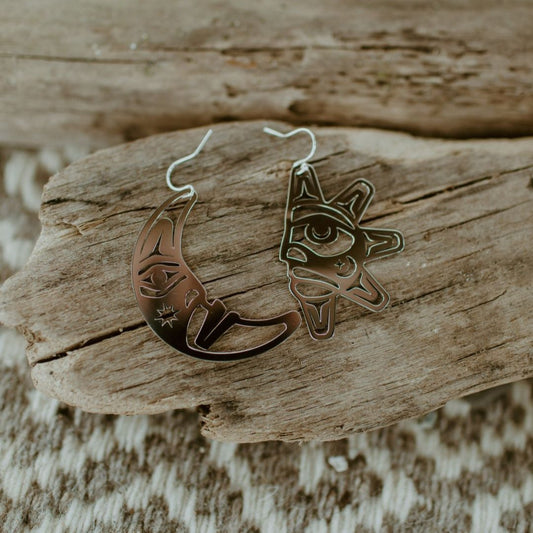 sterling silver sun and moon with formline cut outs from copper canoe woman