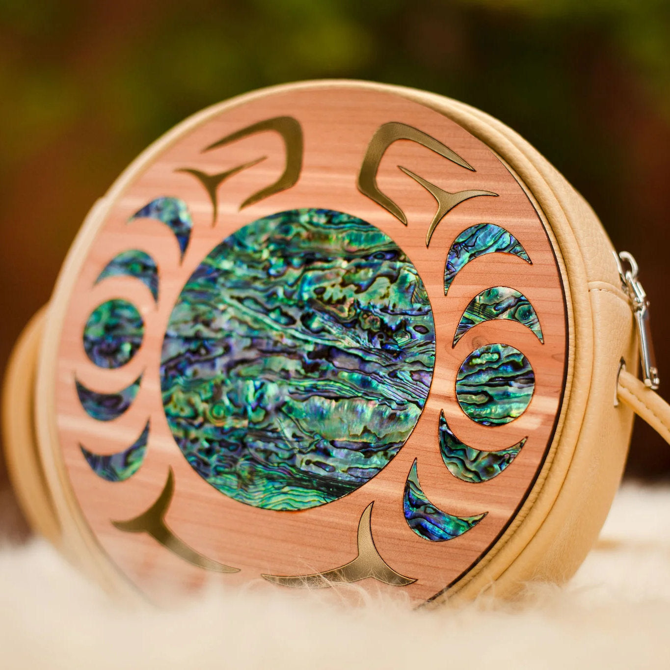 Yellow faux leather handbag with cedar wood Nala design from Copper Canoe Woman with abalone inlay.