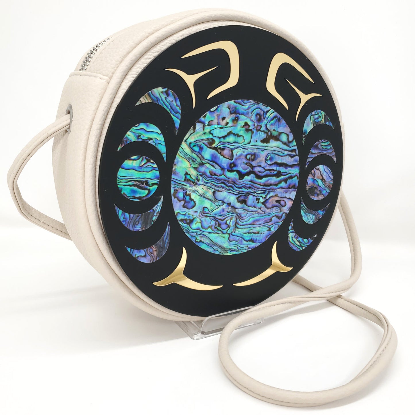 Cream color faux leather handbag with circular Nala design and abalone inlay from Copper Canoe Woman.