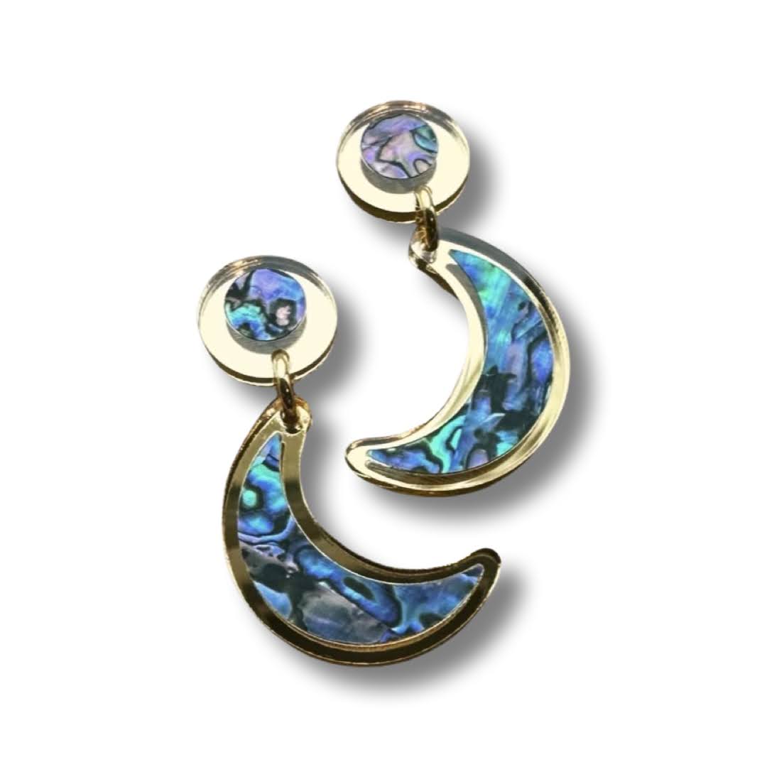 Gold mirror acrylic "Nuci" crescent moon post earrings from Copper Canoe Woman on a white background.