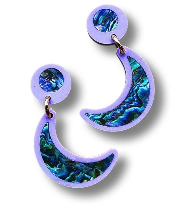 Closeup of a pair of lavender acrylic "Nuci" post earrings from Copper Canoe Woman.