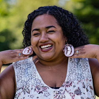 Model wearing large Ovoid Earrings in rose gold mirror acrylic from Copper Canoe Woman 