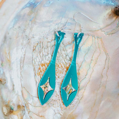 teal mirror acrylic paddle earring with star abalone inlay from copper canoe woman