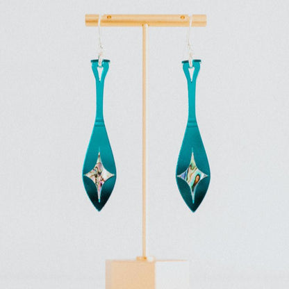 teal mirror acrylic paddle earring with star abalone inlay from copper canoe woman